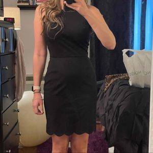 Black scalloped dress, has stretch to it.